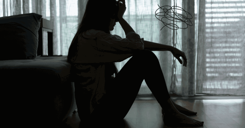 40代独身女性が過去を振り返り後悔の気持ちを抱えている様子を表すシルエット
